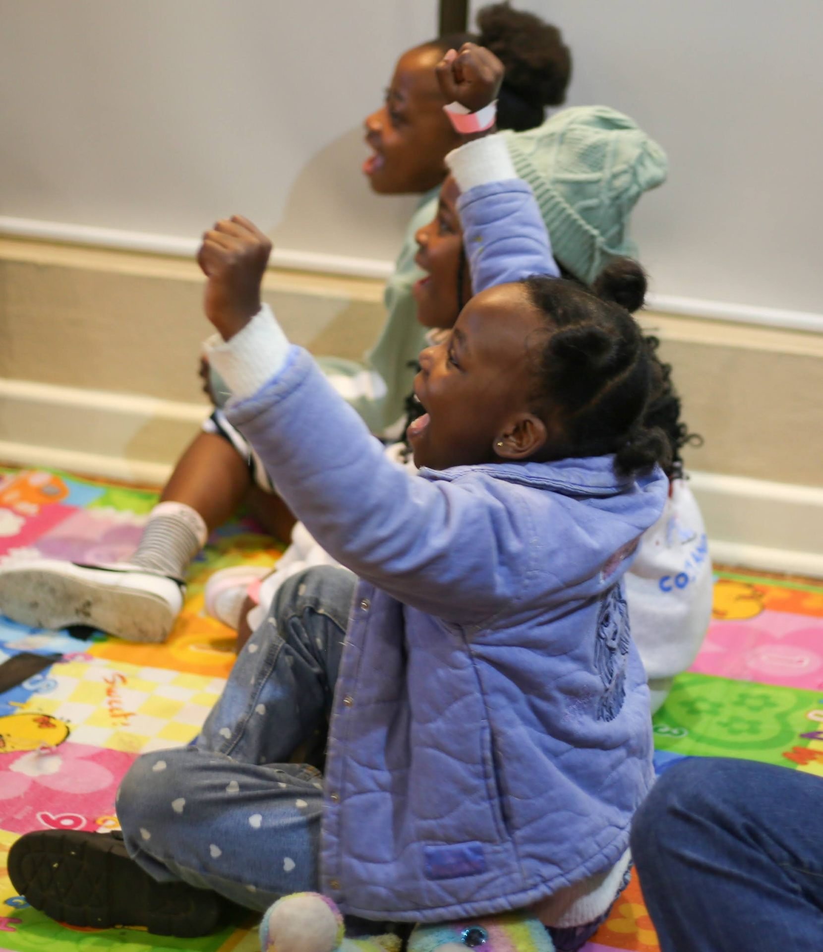 REIGN Kids cheering during Sunday morning kids ministry