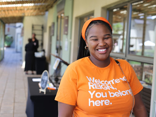 REIGN Church members welcoming a new guest — a place to belong